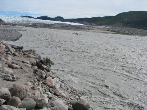 Figure 2. Late season meltwater discharge from the Leverett Glacier. The river's brown color comes from a high load of suspended sediments. Photo courtesy of Ben Linhoff.