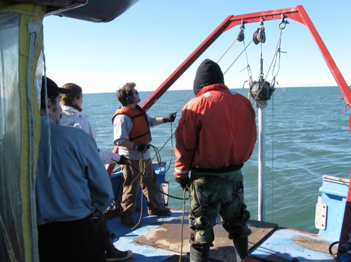 The research team retrieves sediment cores. Image courtesy of Mead Allison, University of Texas.
