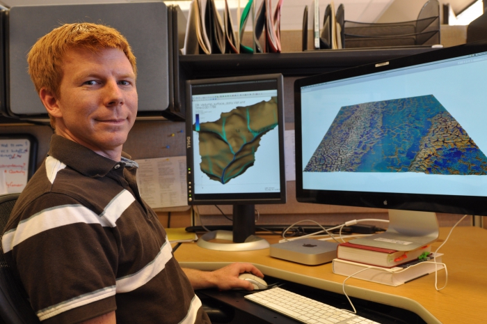 Ethan Coon uses advanced visualization software to understand simulations of snowmelt in Barrow, Alaska. Photo courtesy of Josh Smith, LANL.