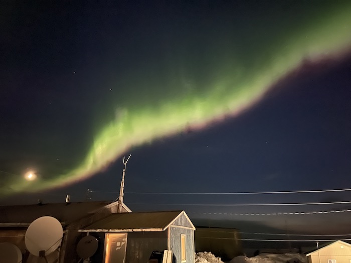 Northern lights over the community of Shishmaref in spring 2021. Image courtesy of Kaare Sikuaq Erickson.