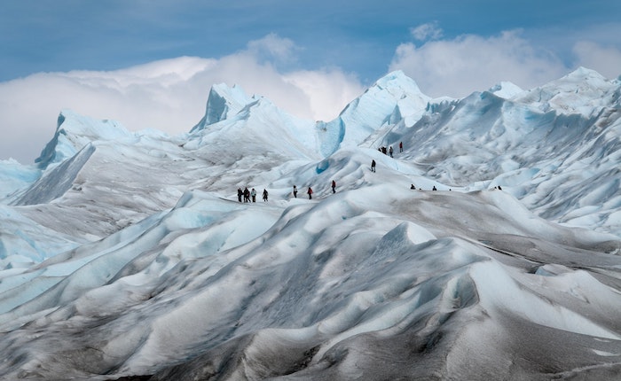 Figure 3. Photo of trekkers climbing snow filled mountains from Entry Points to Reduce Climate-Fragility Risks discussion in Climate-Fragility Risk Brief. Photo courtesy of S&amp;B Vonlanthen.