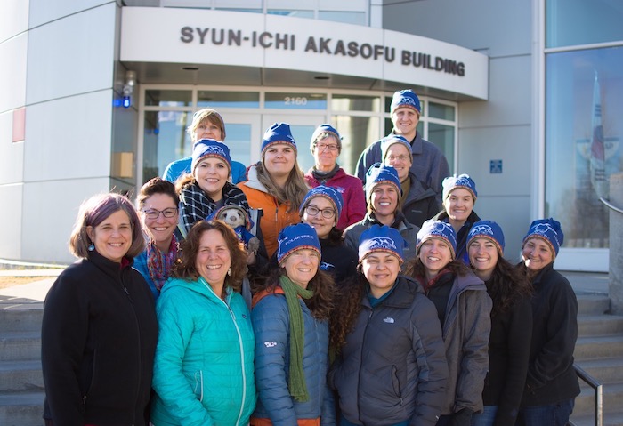 The 2019 PolarTREC Cohort and project management team pose for a photo outside the Syun-Ichi Akasofu Building on the University of Alaska Fairbanks campus during program orientation that was held in March 2019. The orientation is the only time the educators meet one another face to face. During the orientation, they learn about the program, discuss how to communicate their experience and the science to the public, and learn more about the polar regions. Photo courtesy of Joed Polly, ARCUS.