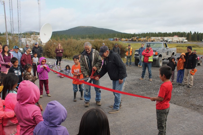 Photo 1. Ribbon cutting over newly paved road in Elim, 2019. Photo courtesy of Davis Hovey.