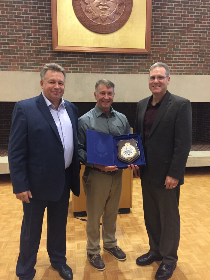 Mr. Michael Emerson, Director, Maritime Transportation Systems, (center) and RADM Michael McAllister, Coast Guard District 17 Commander, (right) recognized by the Russian Ministry of Transport, Andrey Viktorovich Khaustov, General Director of the State Marine Pollution Control, Salvage and Rescue Administration of the Russian Federation (left). Photo courtesy of Rachel Perron.