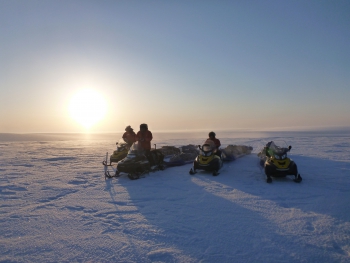 The team stopped for a short break on a calm, cold evening in the Arctic on their final stretch run of a 1,000 mile, three-week round trip traverse between Toolik Field Station and the Teshekpuk Lake Observatory in March 2012 while conducting fieldwork for the NSF-CALON project. Photo courtesy of Guido Grosse.