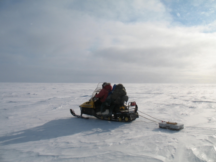 Benjamin Jones and Christopher Arp measuring lake ice thickness with a ground penetrating radar (GPR) system. The data from the GPR are used to distinguish where lakes are frozen to their bed and where they retain water below the ice which is important for the development of thaw bulbs in the permafrost below lakes. Photo courtesy of Christopher Arp.