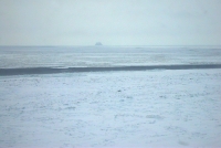 11 April 2012 - View of shorefast ice, narrow lead, and drift ice off Wales. Pho