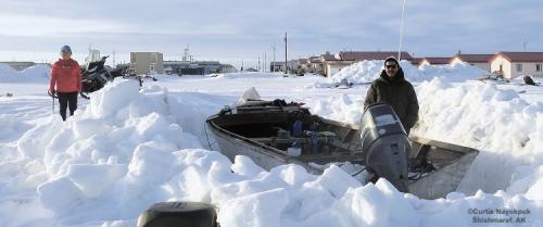 Hunters digging out boats and prepping gear in Shimaref. Photos courtesy of Curtis Nayokpuk.