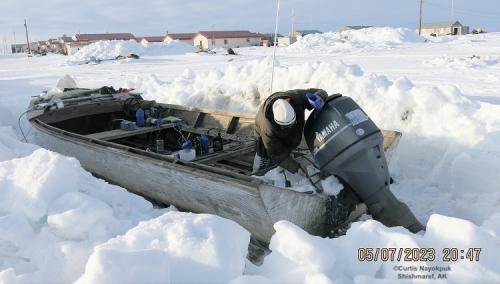Hunters digging out boats and prepping gear in Shimaref. Photos courtesy of Curtis Nayokpuk.