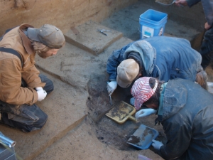 Excavating the burial pit