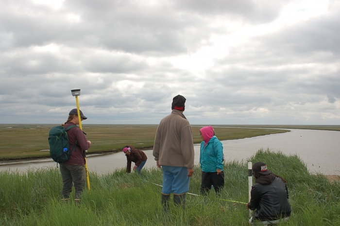 Figure 3. Installing erosion monitoring in Chevak, Alaska in June 2017. Photo courtesy of Denise Pollock. 