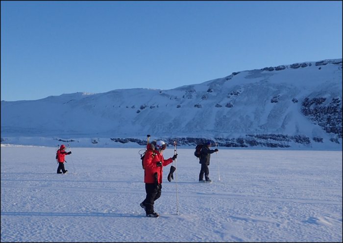 Figure 1. USNA midshipmen conducting snow depth surveys over fast-ice on North Star Bay using GPS-enabled MagnaProbes. Picture taken by Dr. Joseph Smith.