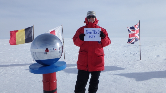 Kate Miller supports PolarTREC at the Ceremonial South Pole in Antarctica. Photo by Samuel Flis, courtesy of Kate Miller (PolarTREC 2016), courtesy of ARCUS.