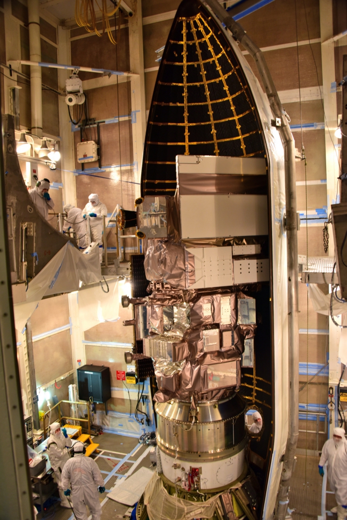 The first half of the United Launch Alliance Delta II payload fairing is secured around NASA&#39;s Ice, Cloud and land Elevation Satellite-2 (ICESat-2) on 4 September 2018, at Space Launch Complex 2 at Vandenberg Air Force Base in California. The satellite will carry the Advanced Topographic Laser Altimeter System (ATLAS). Photo courtesy of Alex Valdez, USAF 30th Space Wing.