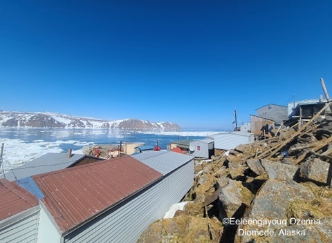 View from Diomede looking toward Big Diomede Island. The ice at the beach an up north is all from Russia side.