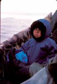 St. Lawrence Island child traveling by skin boat. Photo courtesy of Brendan Kelly.