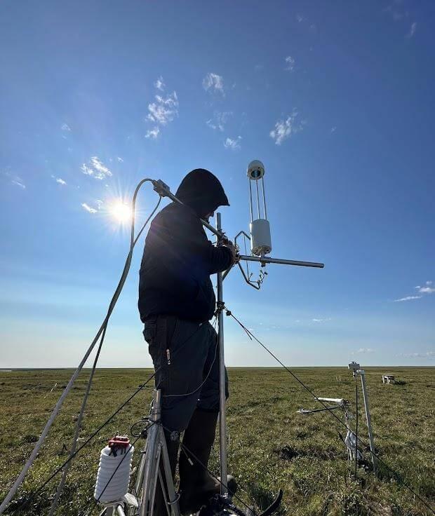 Figure 1. Installation of a heated sonic anemometer system at US-ATQ near Atqasuk, Alaska. Heated systems are a unique requirement of year-round Arctic measurements. Photo courtesy of Kristine Bernabe, San Diego State University