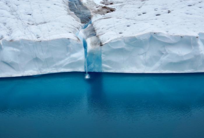 Figure 2. Impacts of Arctic warming include the melting of glaciers and ice sheets leading to a rise in sea levels. Above: Melt water from Ryder Glacier ice tongue in the Sherard Osborn Fjord in NW Greenland. Image courtesy of John Farrell, USARC.