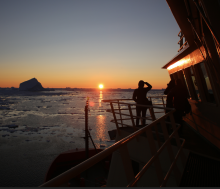 Image of a sunset over the Arctic ocean viewed from an icebreaker