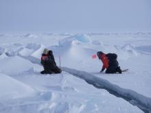 Cathy Geiger and Nick Hughes set up a station to measure the width of the lead. At the SEDNA/APLIS Ice Camp north of Prudhoe Bay, Alaska. Cathy Geiger and Nick Hughes set up a station to measure the width of the lead. At the SEDNA/APLIS Ice Camp north of Prudhoe Bay, Alaska.
