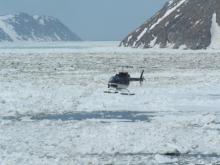 Helicopter comes in to land on the USCG Healy icebreaker after visiting Little Diomede Island, U.S.