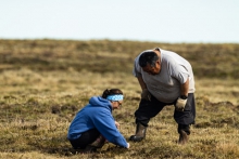 Figure 1. Kimberly Kivvaq Pikok and her father, Lloyd Pikok Sr. study vegetation on the Arctic tundra near the cabin at Pikok Camp on the North Slope of Alaska. Kimberly was telling her dad about Labrador Tea and Heather. Photo courtesy of Lloyd Pikok Jr.