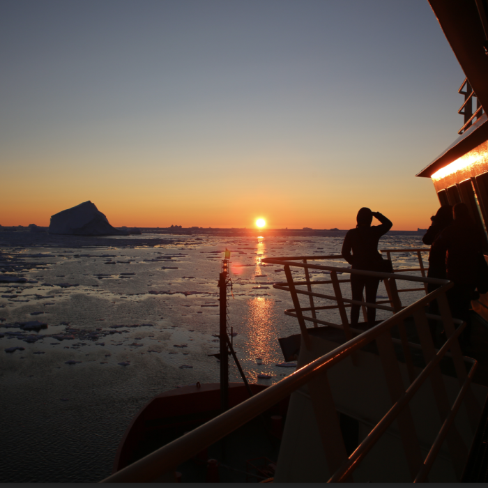 Image of a sunset over the Arctic ocean viewed from an icebreaker