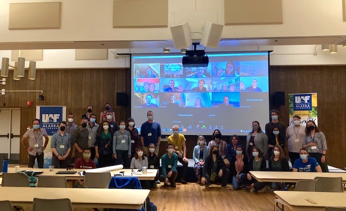 Figure 1. Group photo of virtual and in-person attendees during the closing ceremony. Photo courtesy of  H. Bergstedt.