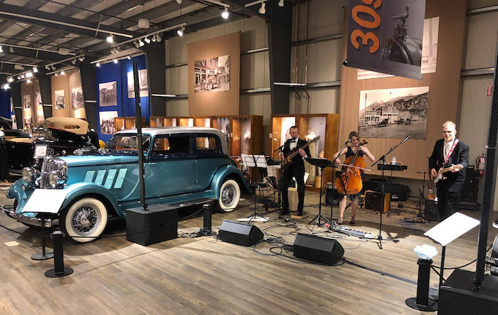 Figure 3. Kinky Slinky, a local Fairbanks band, performed at the ICRSS ice-breaker event held at the Fountainhead Antique Auto Museum. Their performance included the song, &quot;Continental Drift,&quot; that was performed with help from attendees from the Alfred Wegener Institute. Photo courtesy of Scott Goetz.