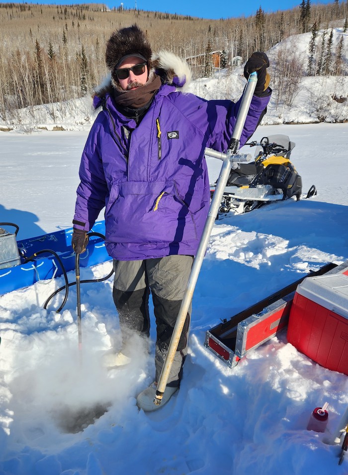Figure 4. Team member, Allen Bondurant, retrieving experimental deployment of an optical backscatter sensor on the Tanana River from sites selected by students at Nenana City School. Photo courtesy of Chris Arp.