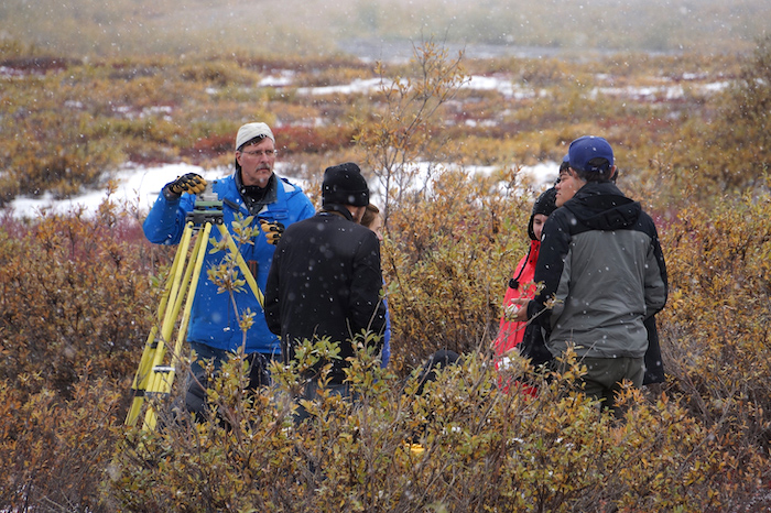 Figure 3. Jeff Freymueller, Michigan State University, and local students working with GPS equipment at Chandler Shelf in Alaska&#39;s Brooks Range. Image courtesy of John Farrell, USARC.