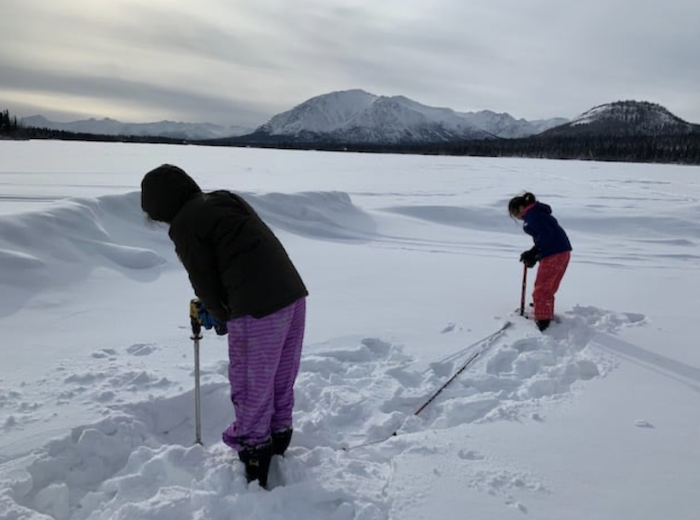 Figure 3a. Students from Copper Valley make monthly measurements of snow and ice thickness on lakes and rivers and observe the timing of freeze-up and break-up. Photo courtesy of Mark Proch.