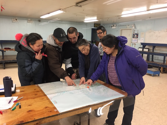Figure 5. Indigenous Knowledge holders share knowledge during a participatory mapping workshop in Kotlik, Alaska. Photo courtesy of Nicole Herman-Mercer, US Geological Survey.